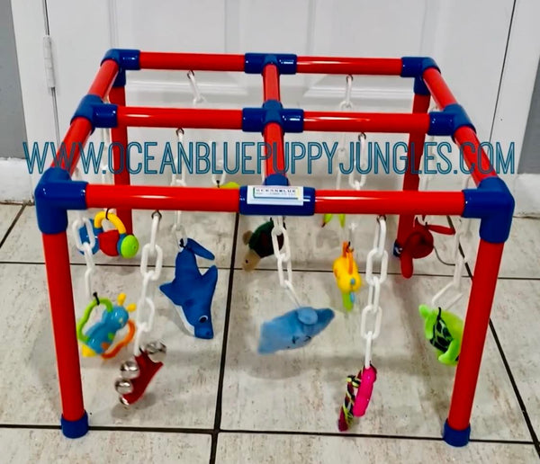 whelping box toy mobile red white & blue